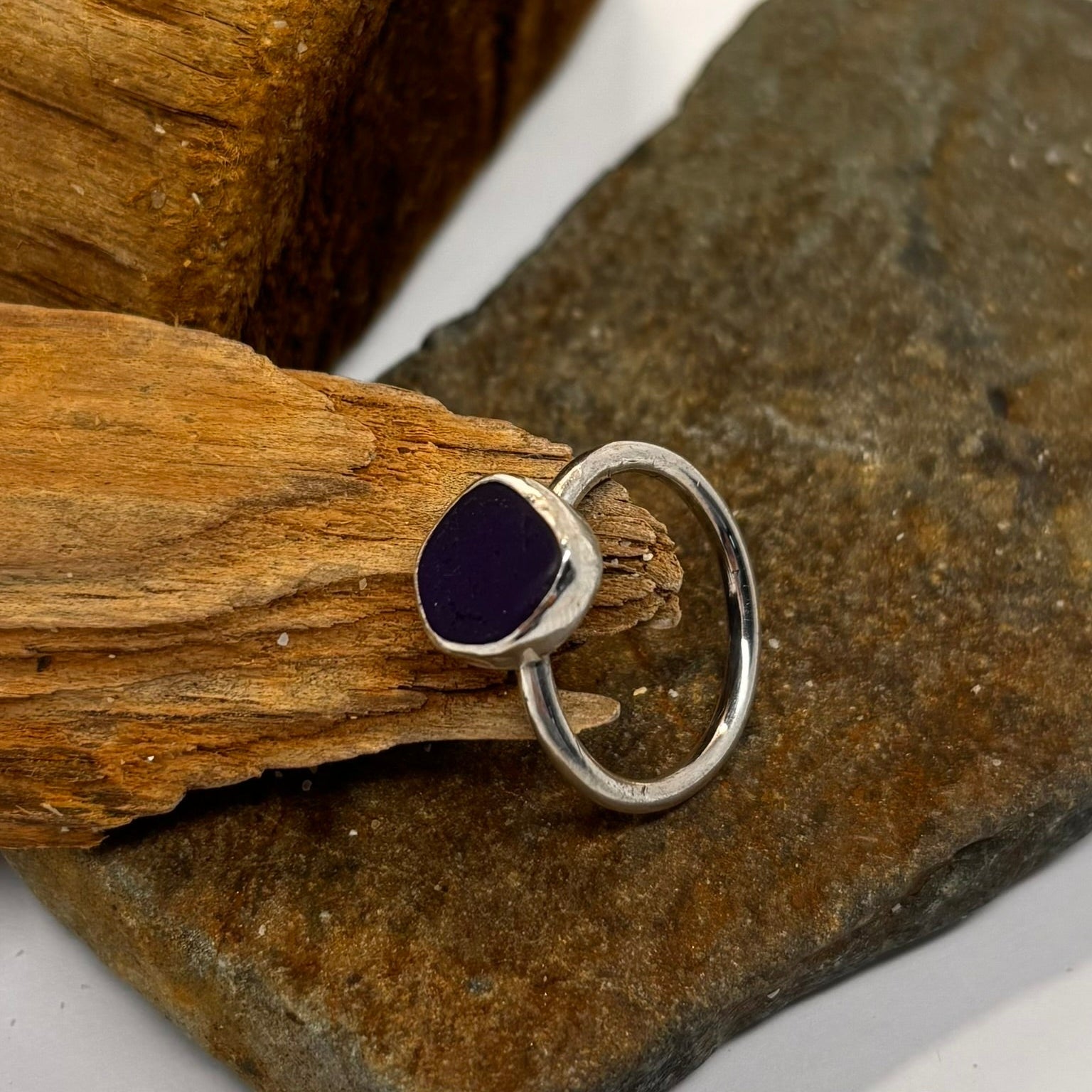 Silver ring with a blue sea glass ina bezel setting